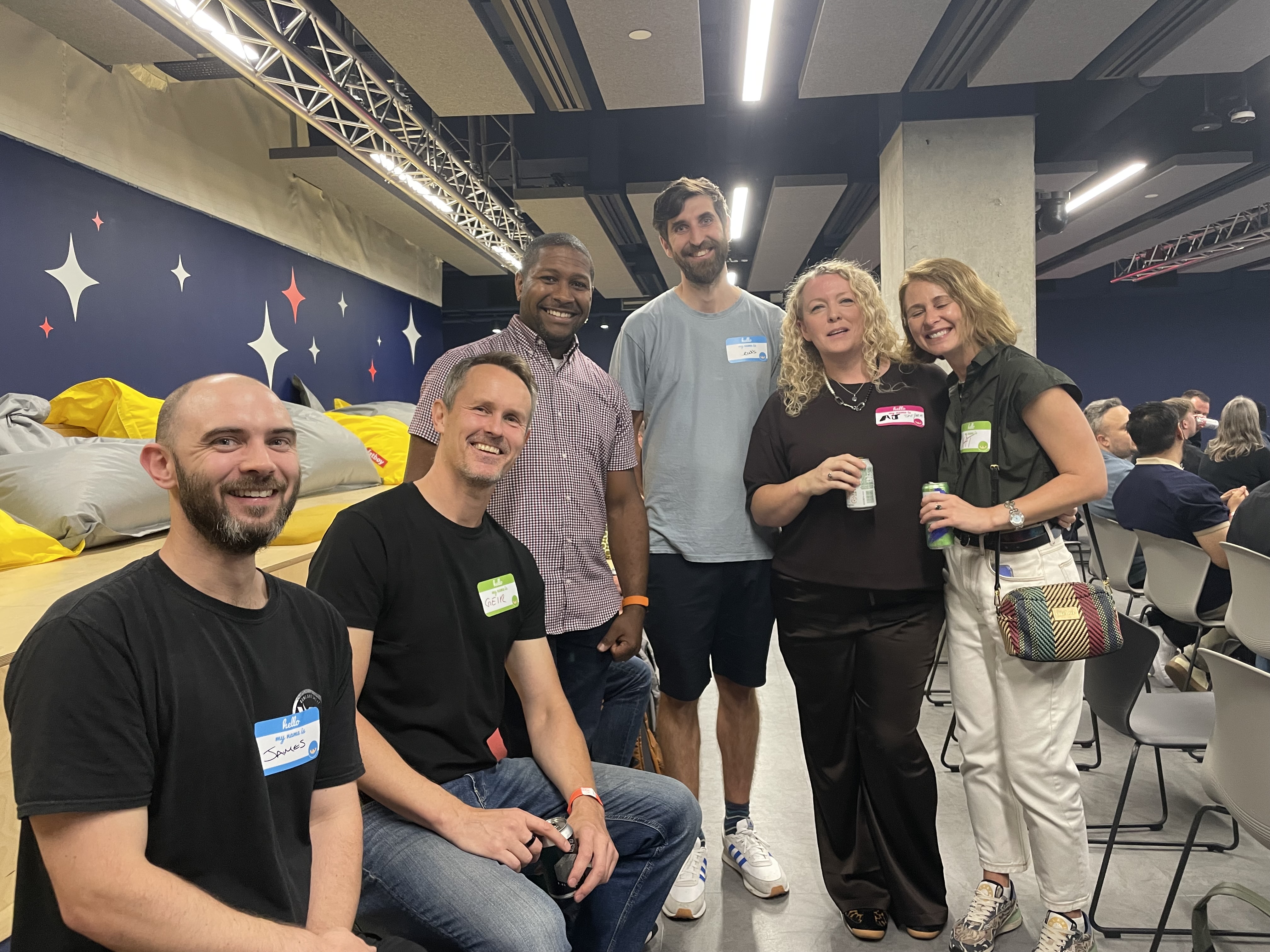 A group photo of good quality happy looking people at MoT London