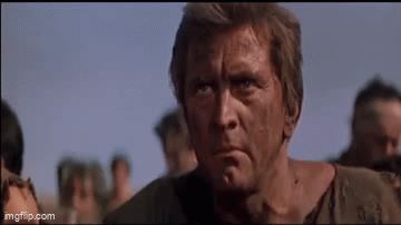 A spartacus gif where three men stand up saying "I'm STEC qualified"