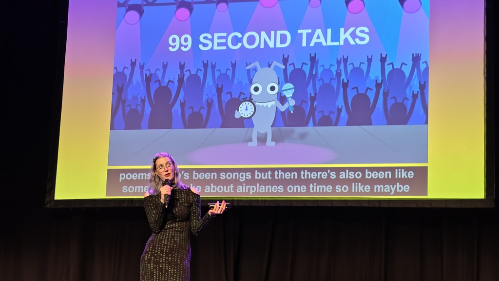 Image showing a slide advertising the MOT 99 Second Talks at MoTaCon image