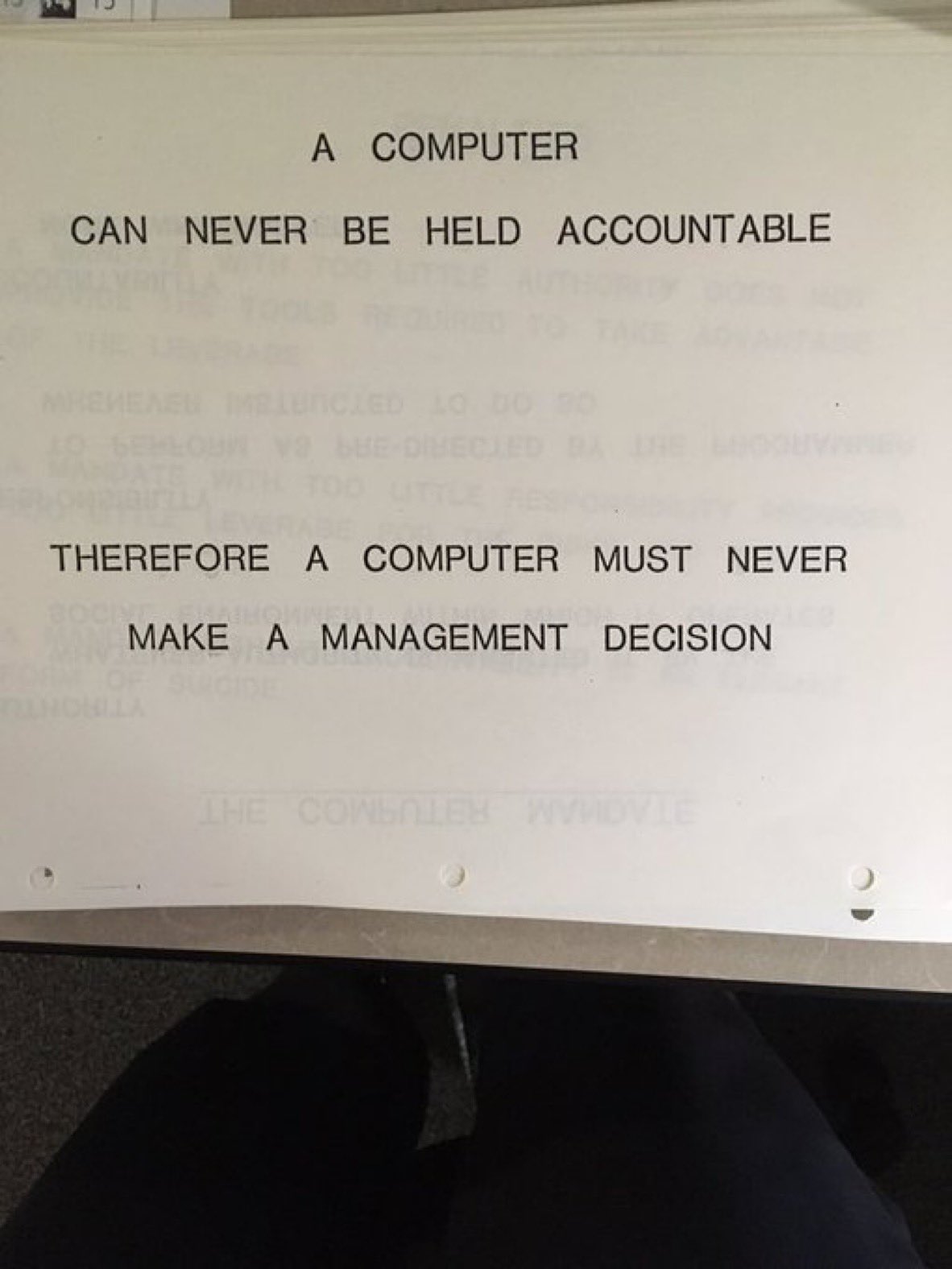 Text stating " a computer can never be held accountable. Therefore a computer must never make a management decision." image