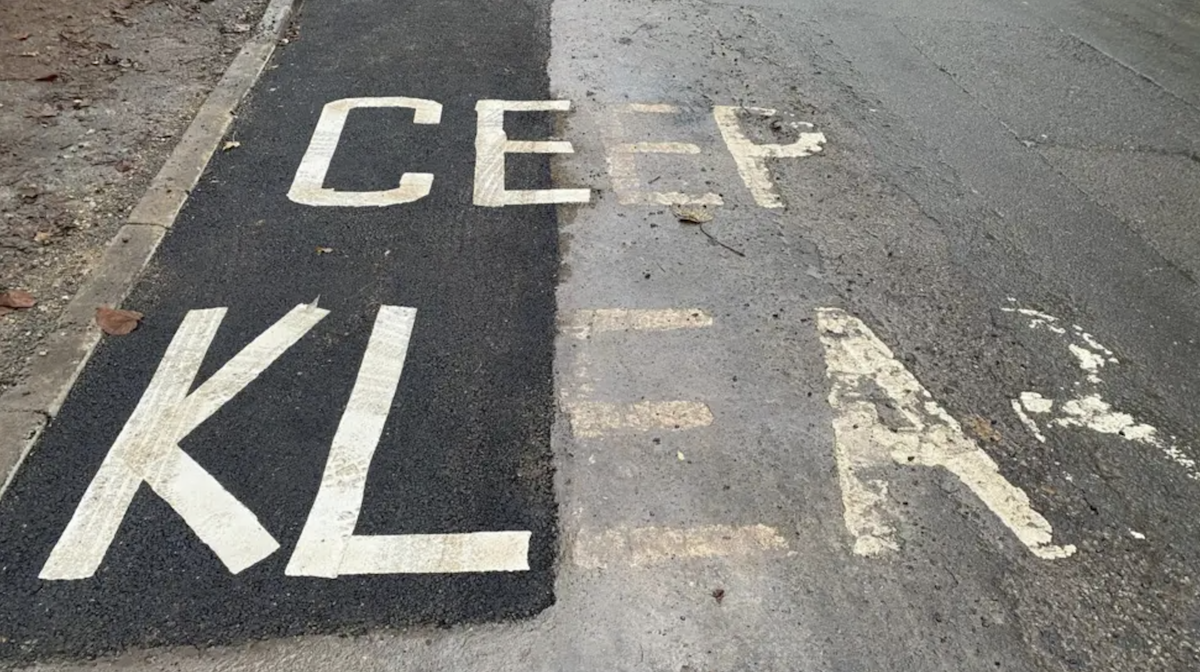 A road marking with the words Ceep Klear on it. 