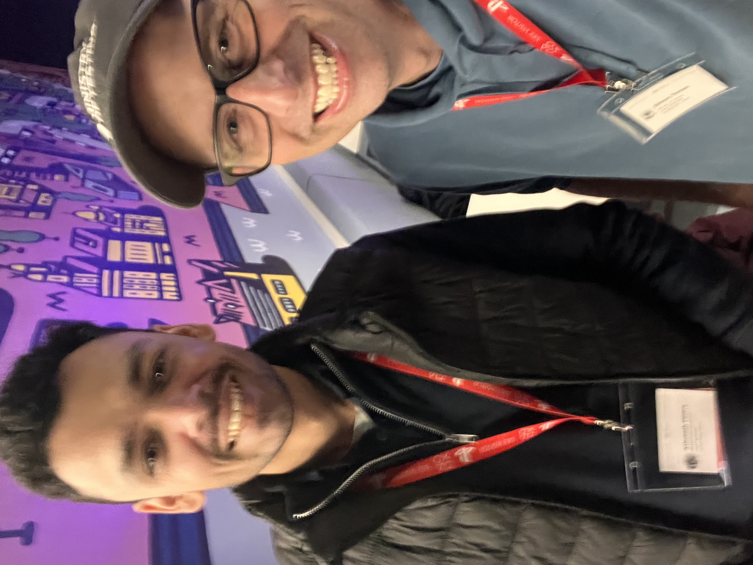Two men posing for a selfie. 