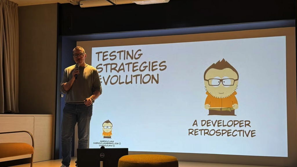 Gabriele Lana speaking at the Ministry of Testing Milan meetup about the evolution of testing strategies, sharing his journey from early unit tests to modern formal methods with the local QA and developer community.