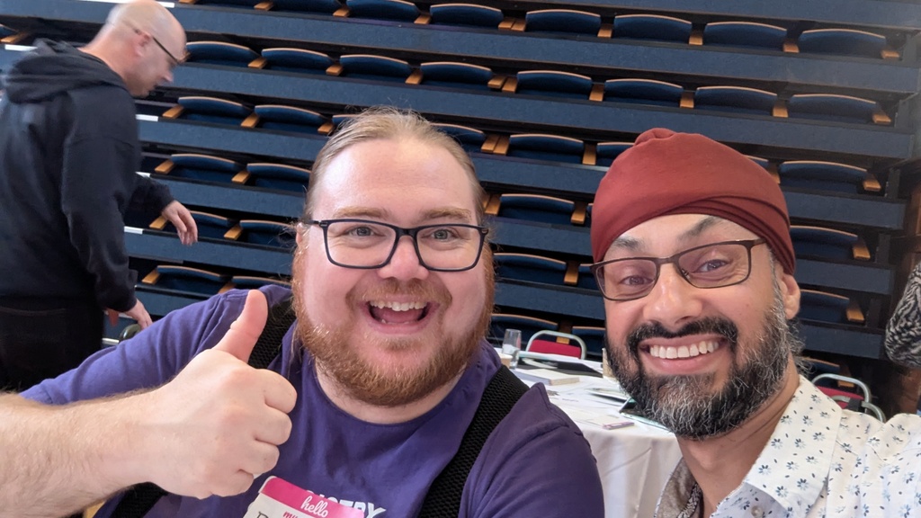 A picture of Dalbir Sehmbi and Ben Dowen sitting next to each other