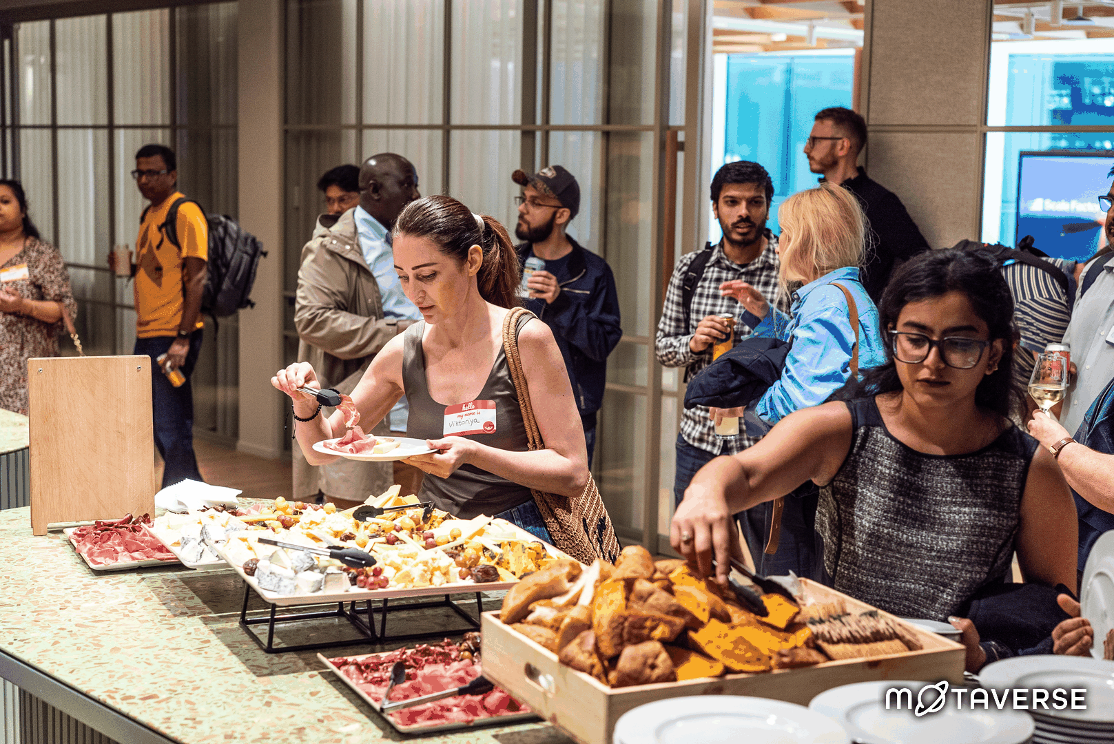 A rotating gif of many quality people and food at MoT London. image