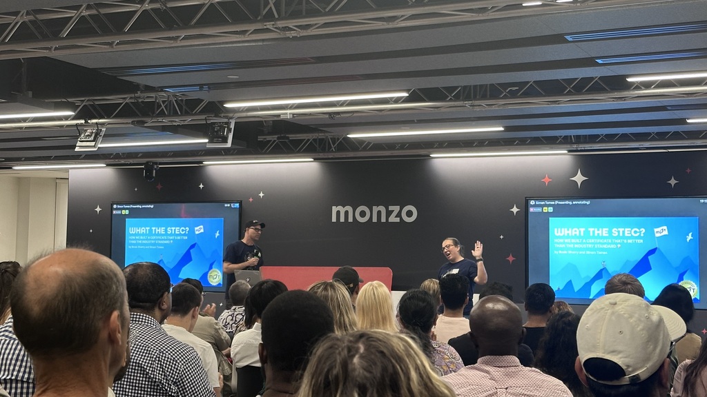 Rosie and Simon presenting to an audience.