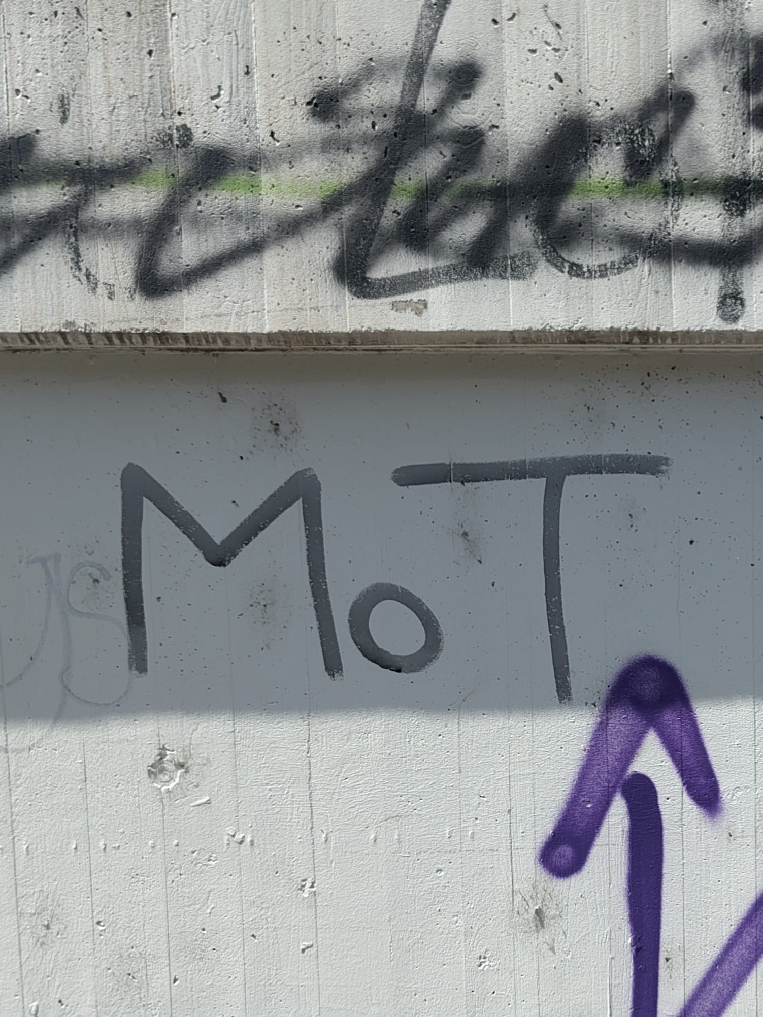 'MoT' graffiti tag on a wall in Leipzig, Germany