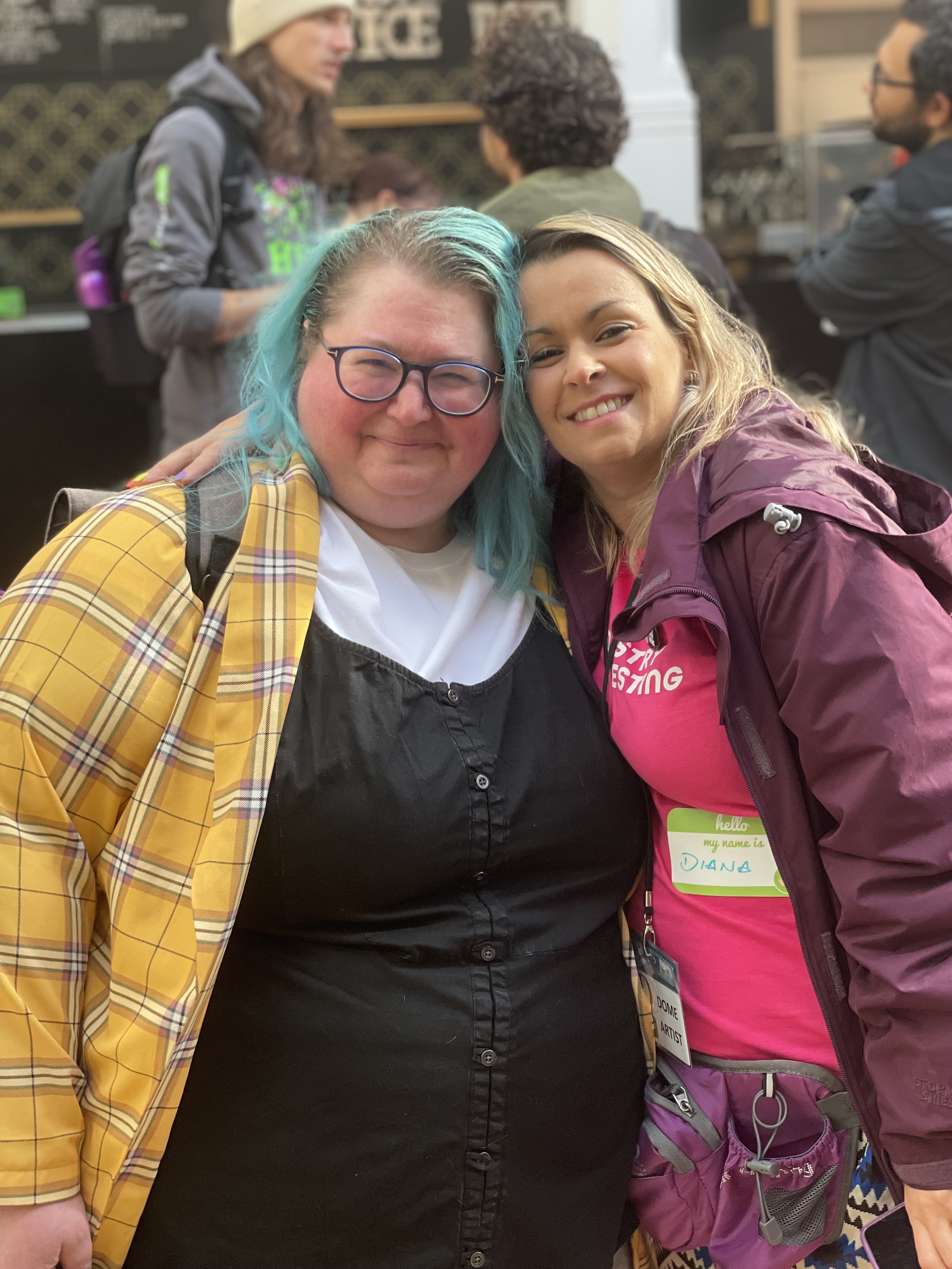 Two very good people, Jenna Charlton and Diana Dromey, give a sidehug and a big smile for the camera.
