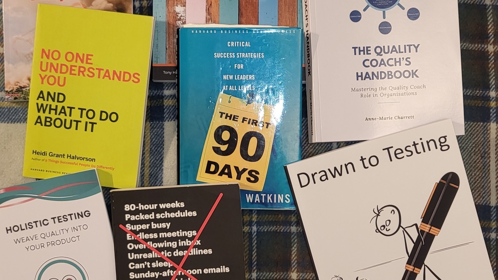 The following books are arranged in a messy grid on top of a blue-checked rug:
1. The Field Guide to Understanding ‘... image
