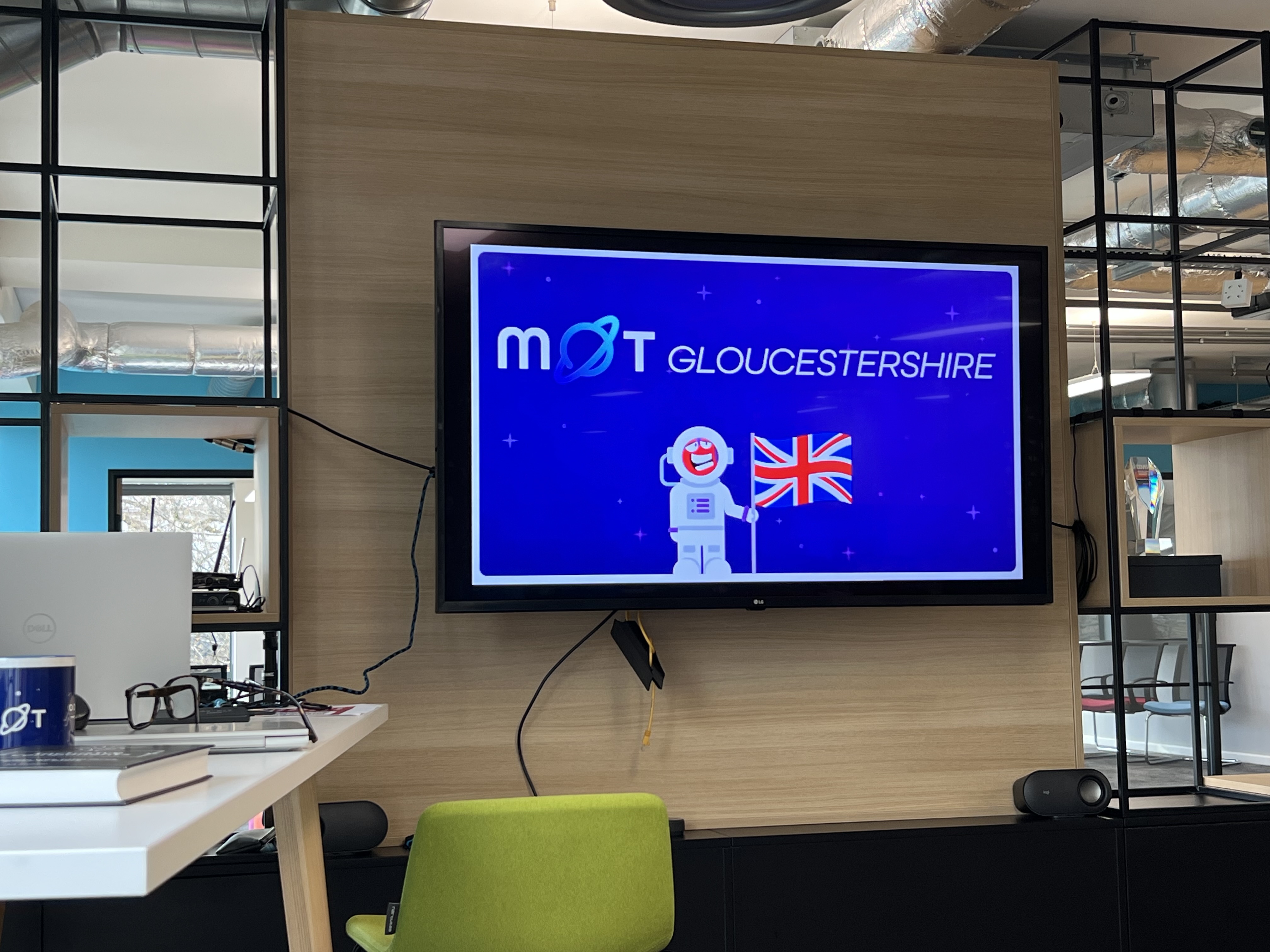 MoT Gloucestershire MoT logo on a tv screen ready to get the event started. 