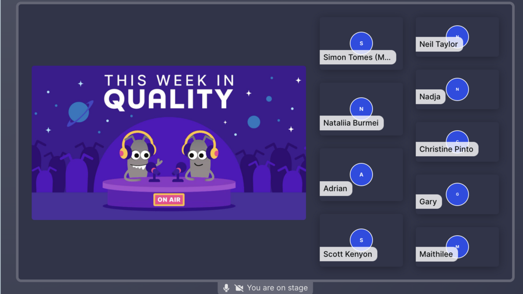 A virtual stage screen for a podcast called "This Week in Quality" features a banner illustration of two cartoon microbes wearing headphones and standing at microphones on a circular purple stage, with planets, stars, and antennae-like figures in the dark purple background. To the right, a list of nine attendees is displayed in dark blue rectangular boxes with their names and initials: Simon Tomes (M...), Neil Taylor, Natalia Burmei, Nadja, Adrian, Christine Pinto, Scott Kenyon, Gary, and Maithilee. The bottom center includes a microphone icon and the text "You are on stage."