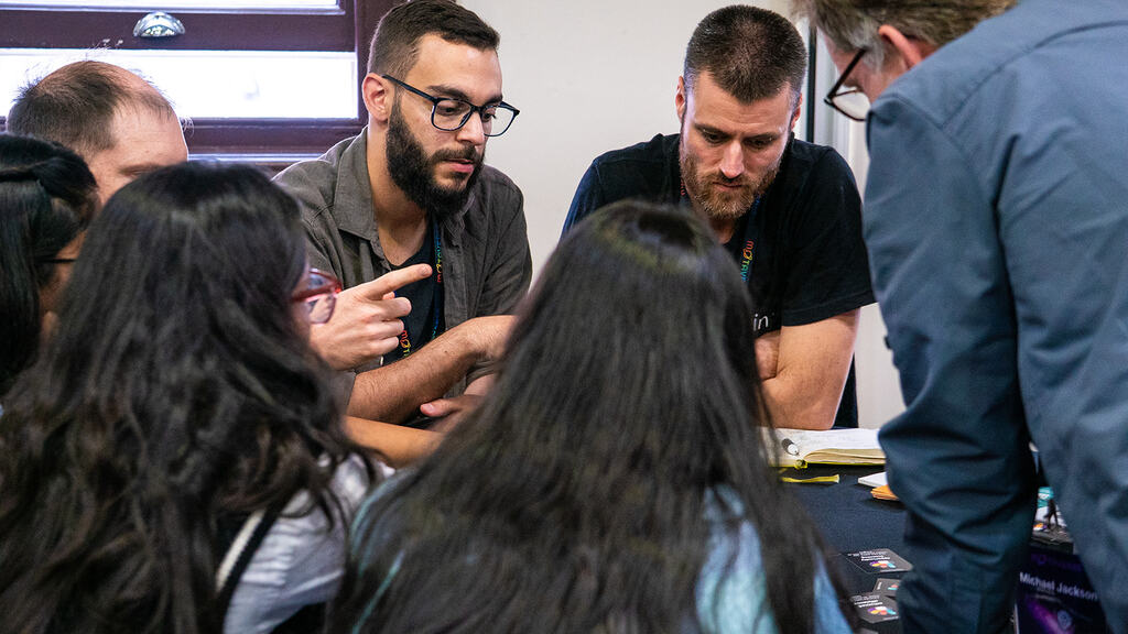People gathered around a Riskstorming and AI session.