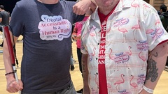 Conor and I with him wearing a t-shirt with my accessibility is a human right graphic while I’m wearing my Hawaiian shirt with the same graphic on it.  image