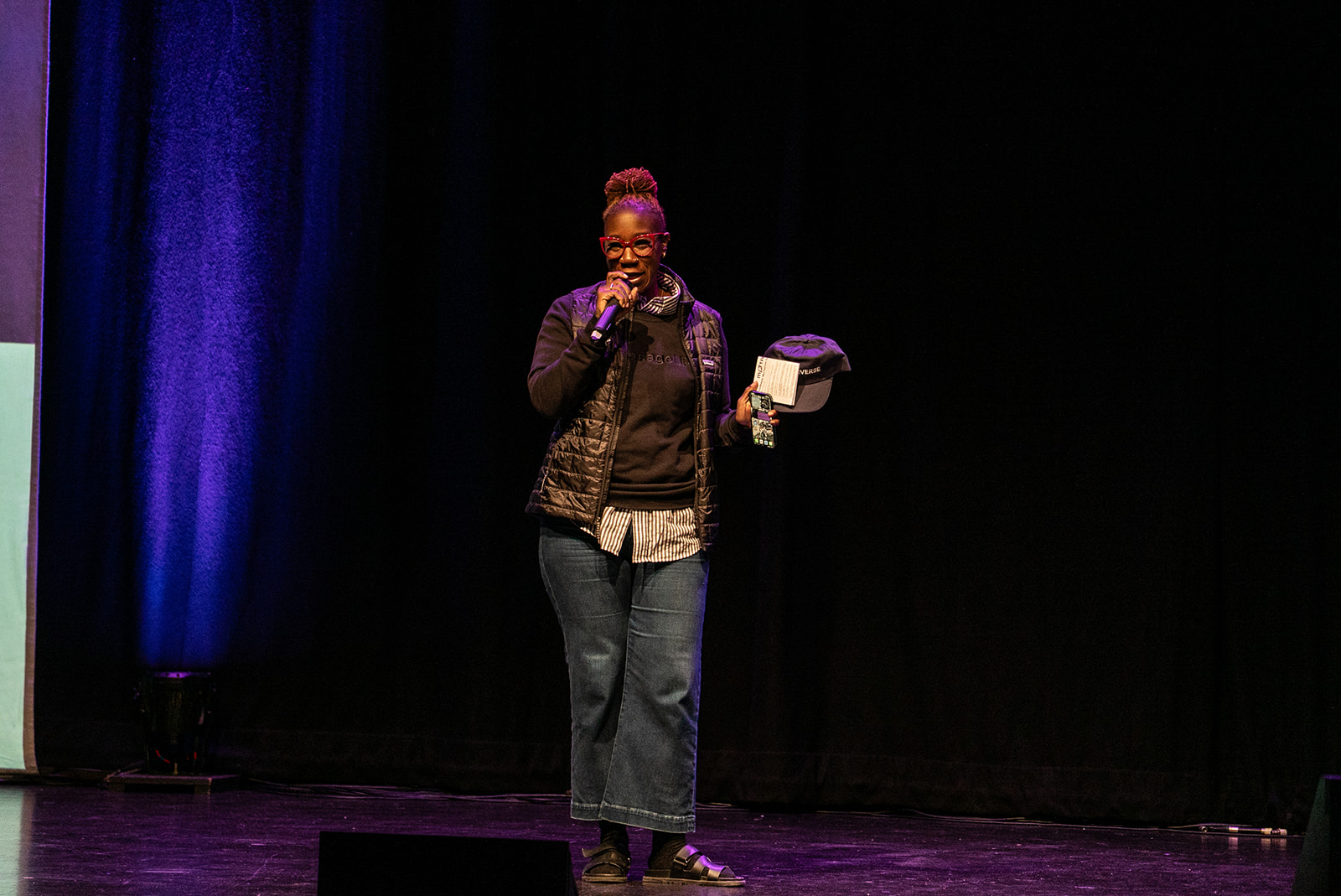 A photo of Ash Hynie on stage at MoTaCon.
