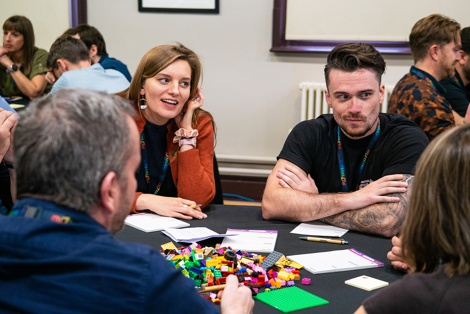 Carola Burmester and other quality people sitting around a table with lego in the middle