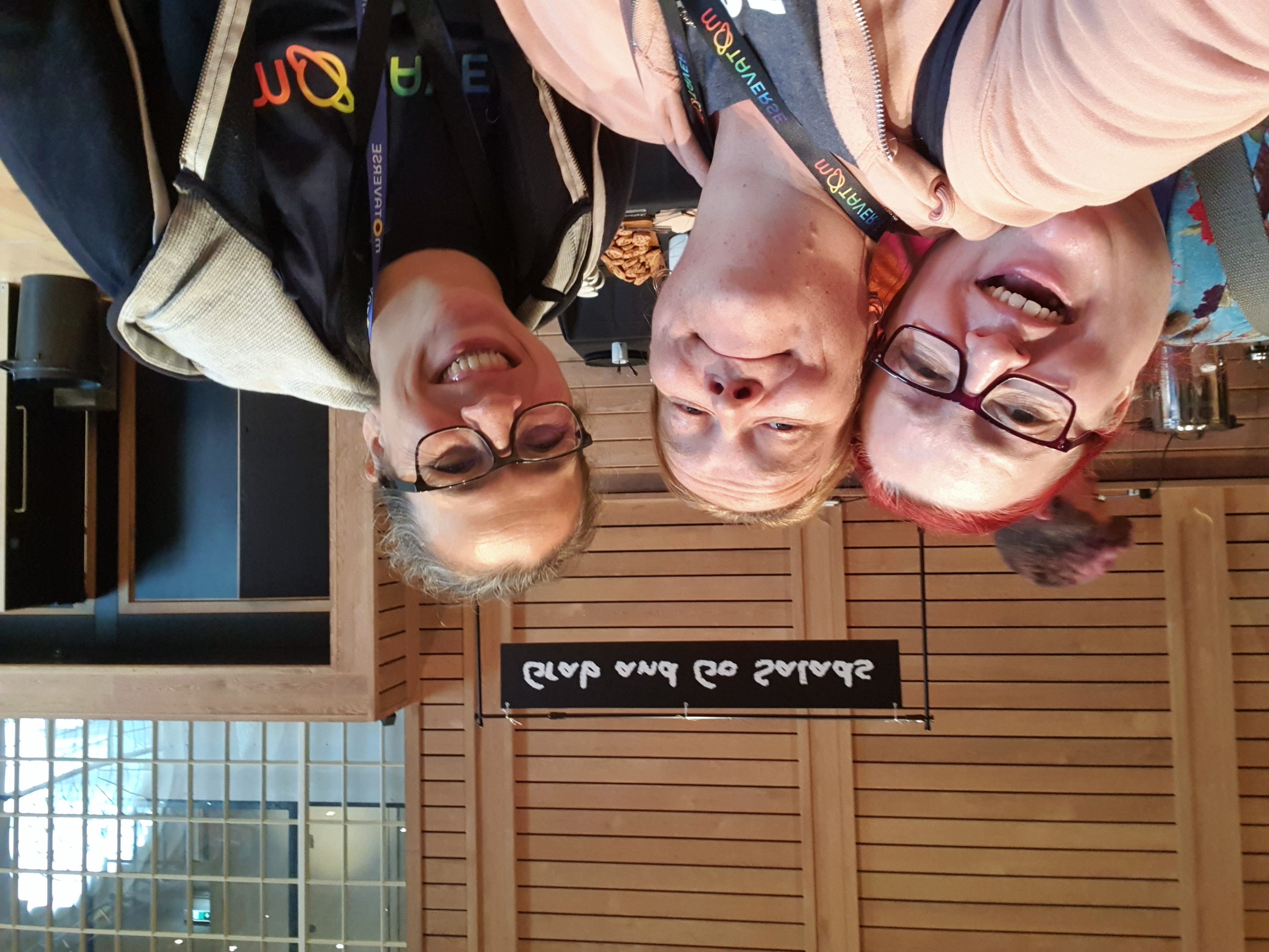 3 women heads tilted back smiling with Rosie, Elly and Nic