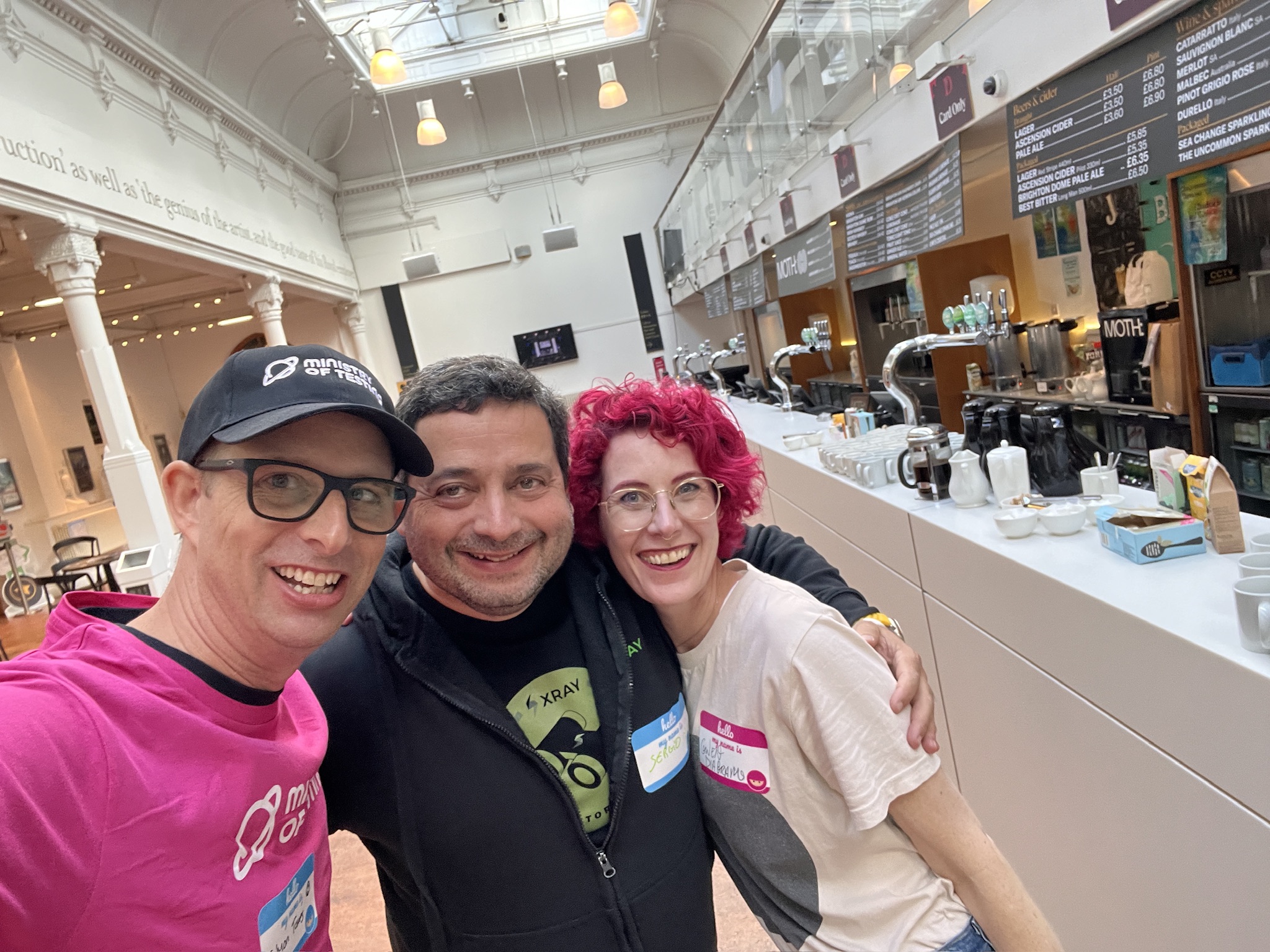 Simon, Sergio and Gwen pose for a selfie at TestBash 2024.