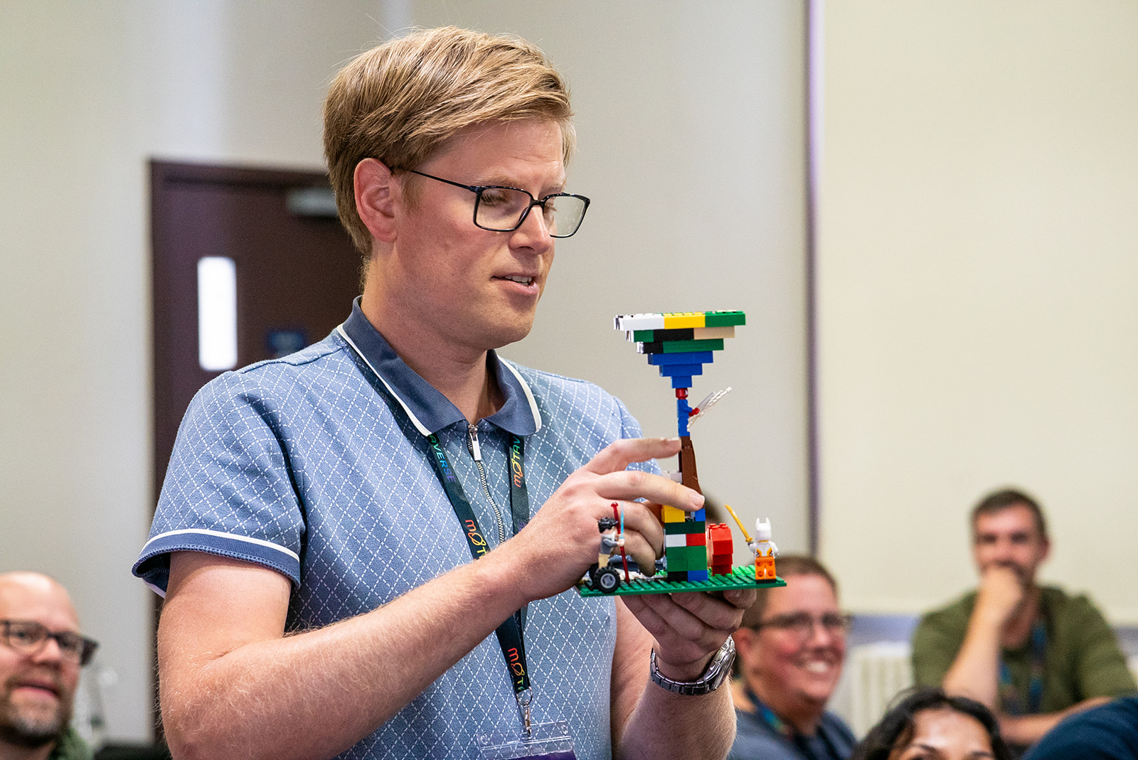 Chris Pratt shows a lego model 