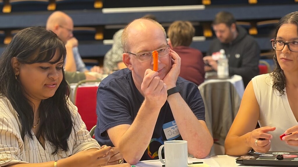 Jesper showing the LEGO brick separator piece with a smirk look image