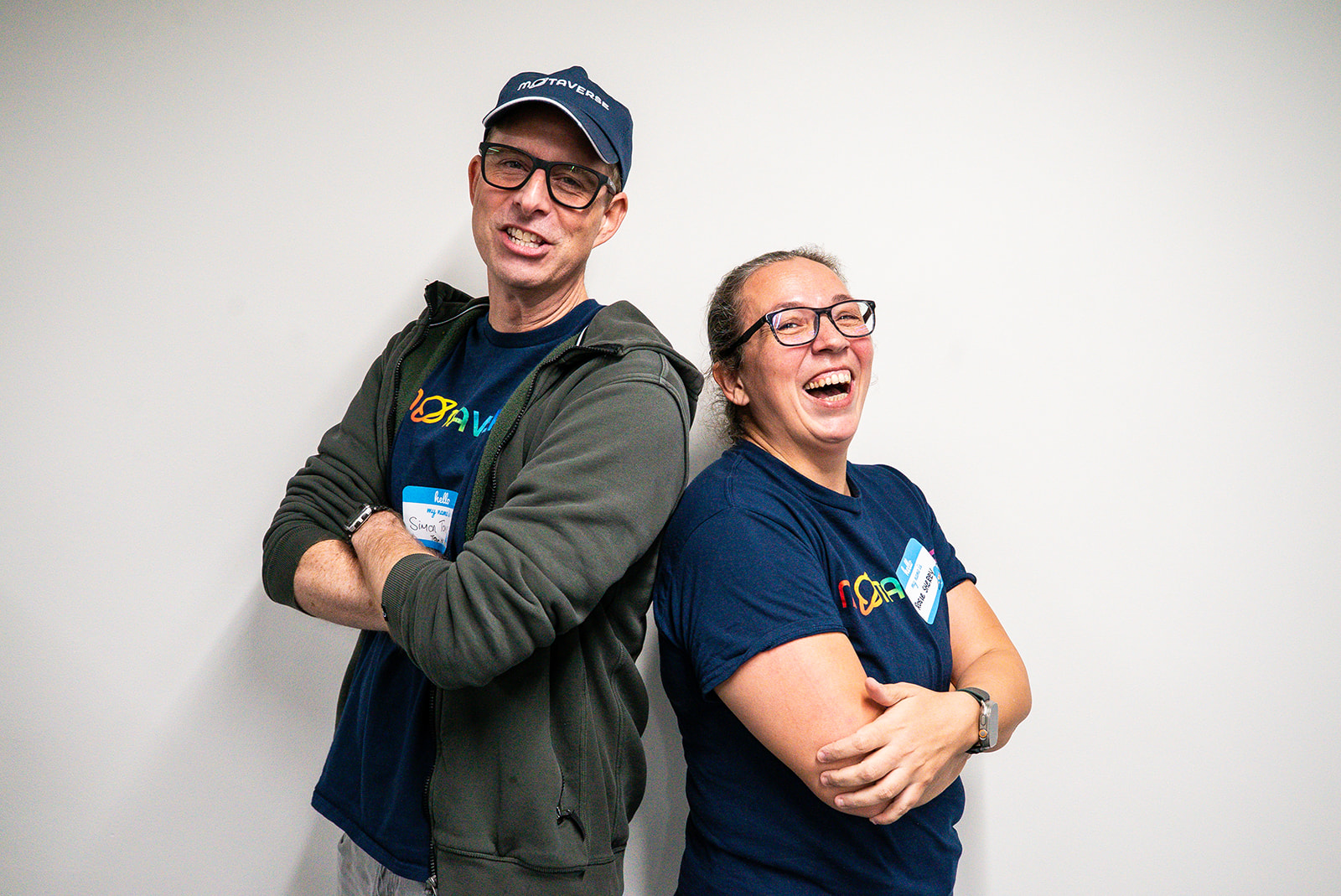 Simon Tomes and Rosie Sherry posing for a photo shout, they are laughing.