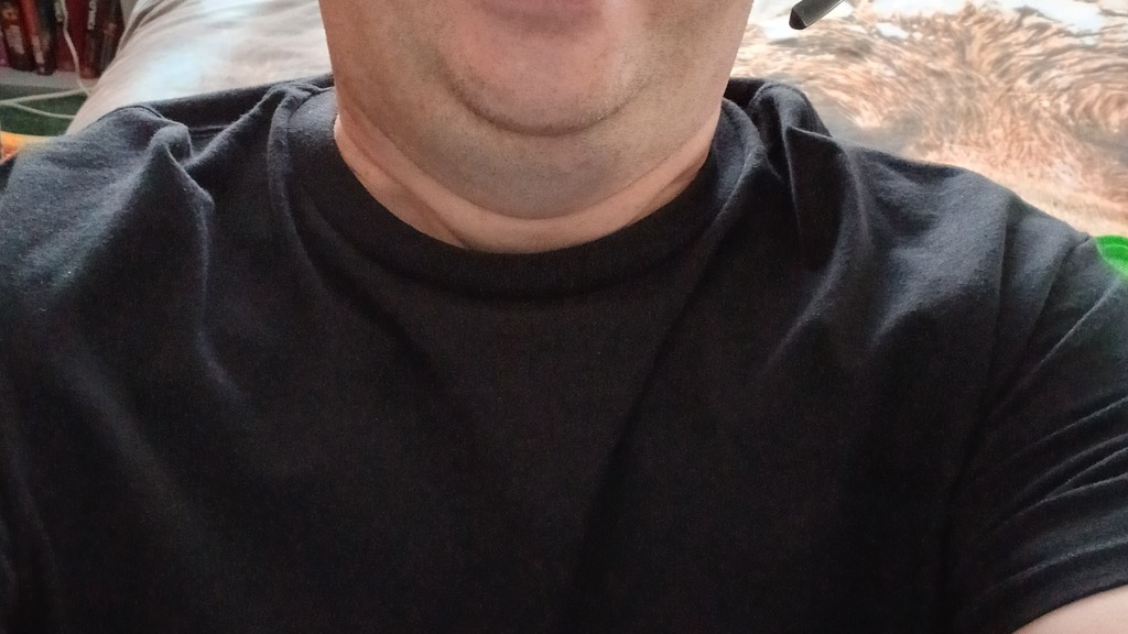 Selfie of Gary at his desik wearing a headset and MoTaverse t-shirt. image