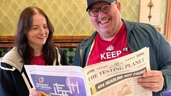 Sarah and I looking at the testing planet newspaper  image