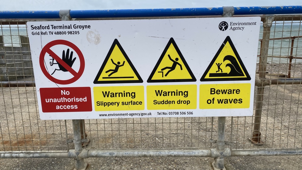 Sea warning 'Beware of the waves' signs. image
