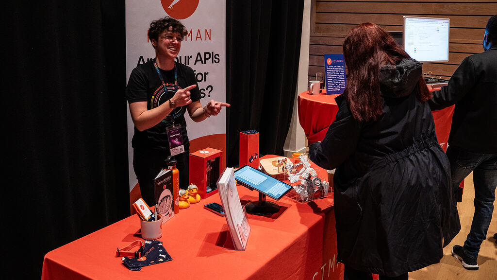 Happy action shot of Marine Meyer of Postman at the MoTaCon25 sponsor stand.