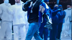 Text saying "look out world going to QA..." Image used is Kendrick Lamar at the 2025 super bowl looking smug. image