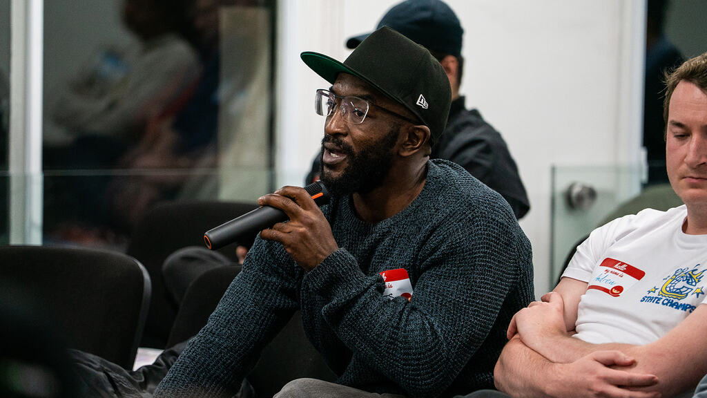 A member of the audience asking a question