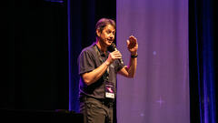 Is Andrew Morton showing how tall I am?

It's more likely he's dishing out puns on the 99 second stage. image