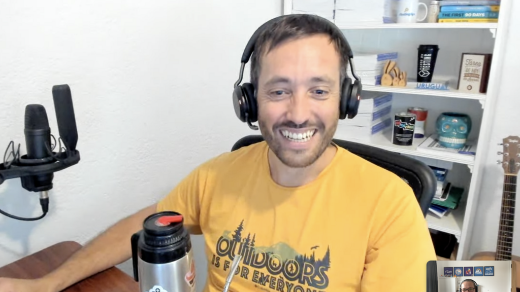 A screenshot of a virtual coffee catch up with Federico, he's looking happy with his waterbottle that Rosie is happy to see a retro MoT logo sticker on it.