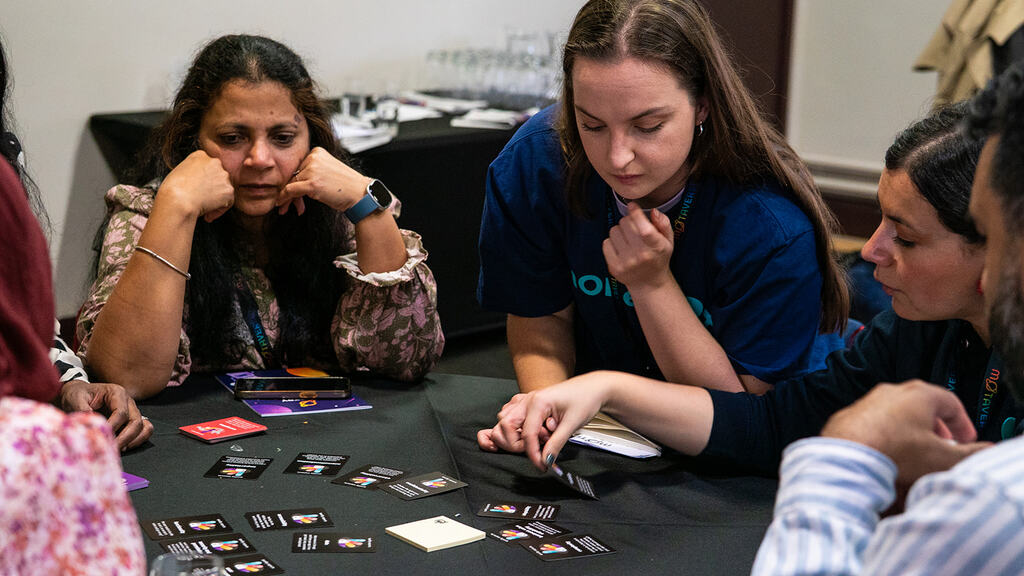People gathered around a Riskstorming and AI session.