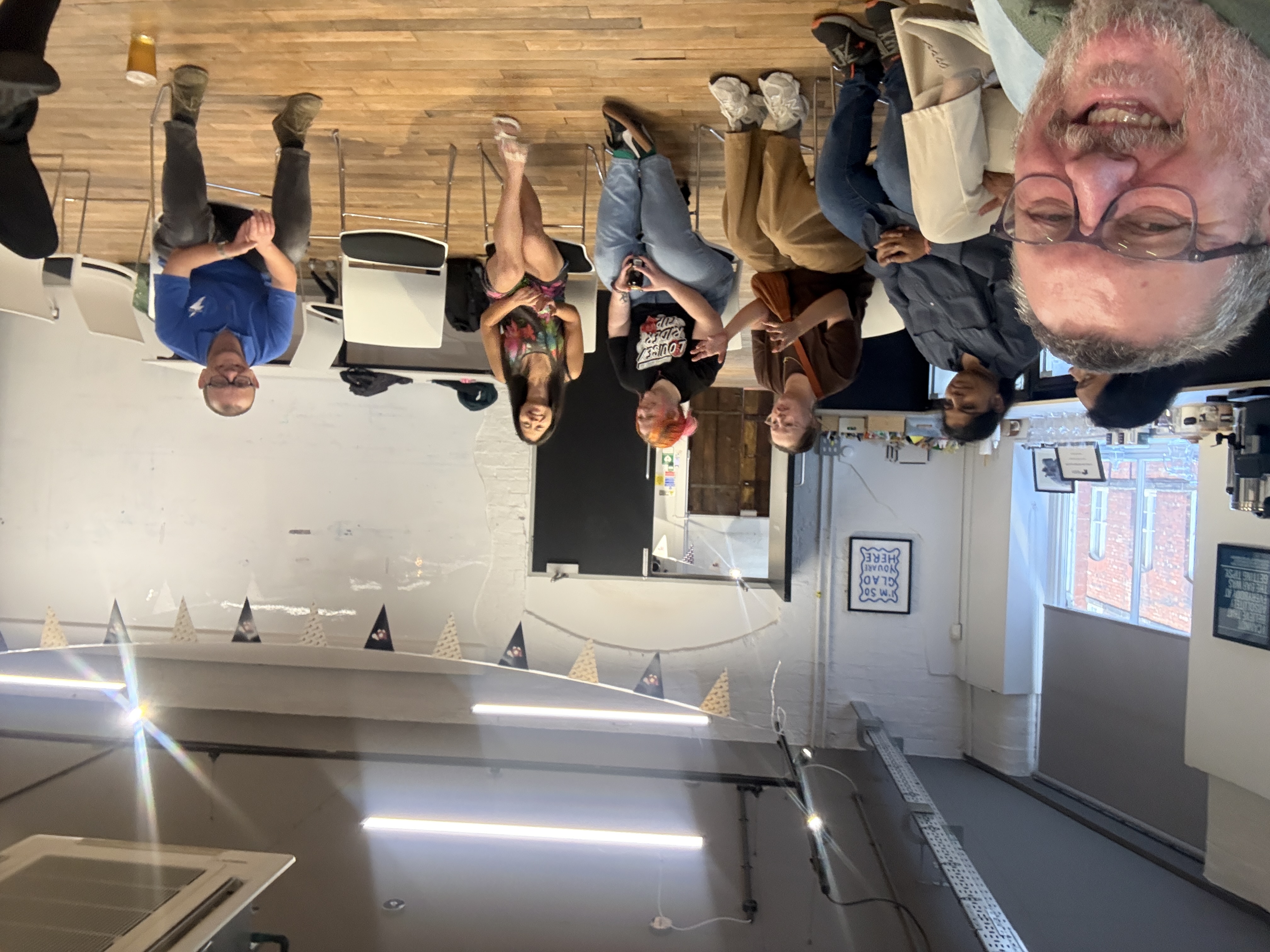 An enthusiastic crowd gathered for the Leeds Chapter sat in a round circle  image