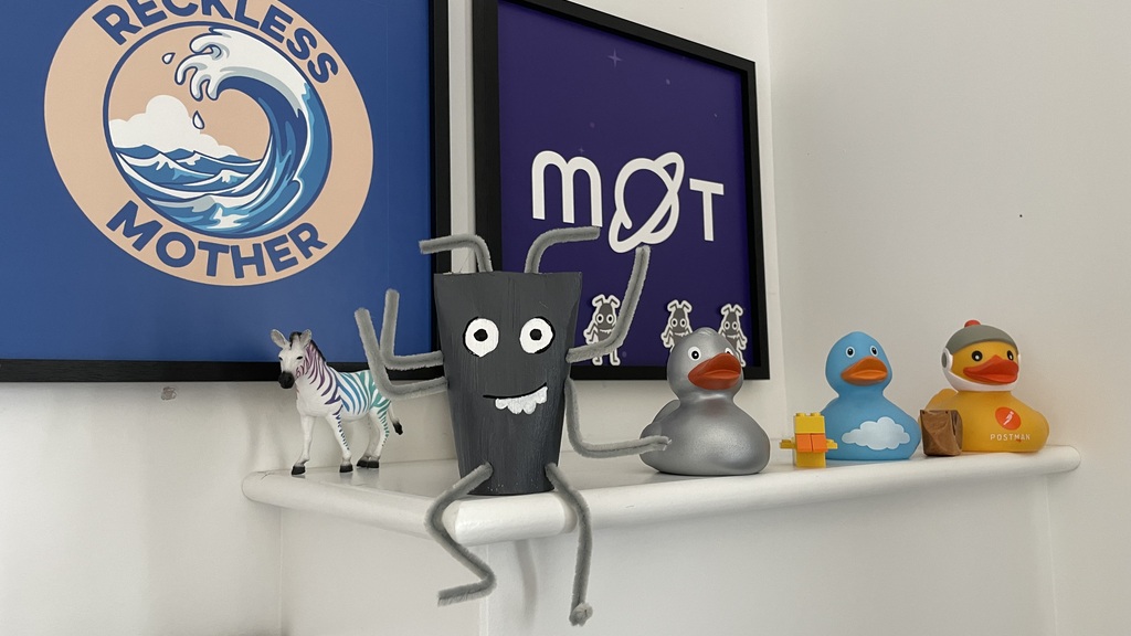 A toilet roll bug sitting on a wall along side ducks, a rainbow zebra, reckless mother picture and mot picture.
