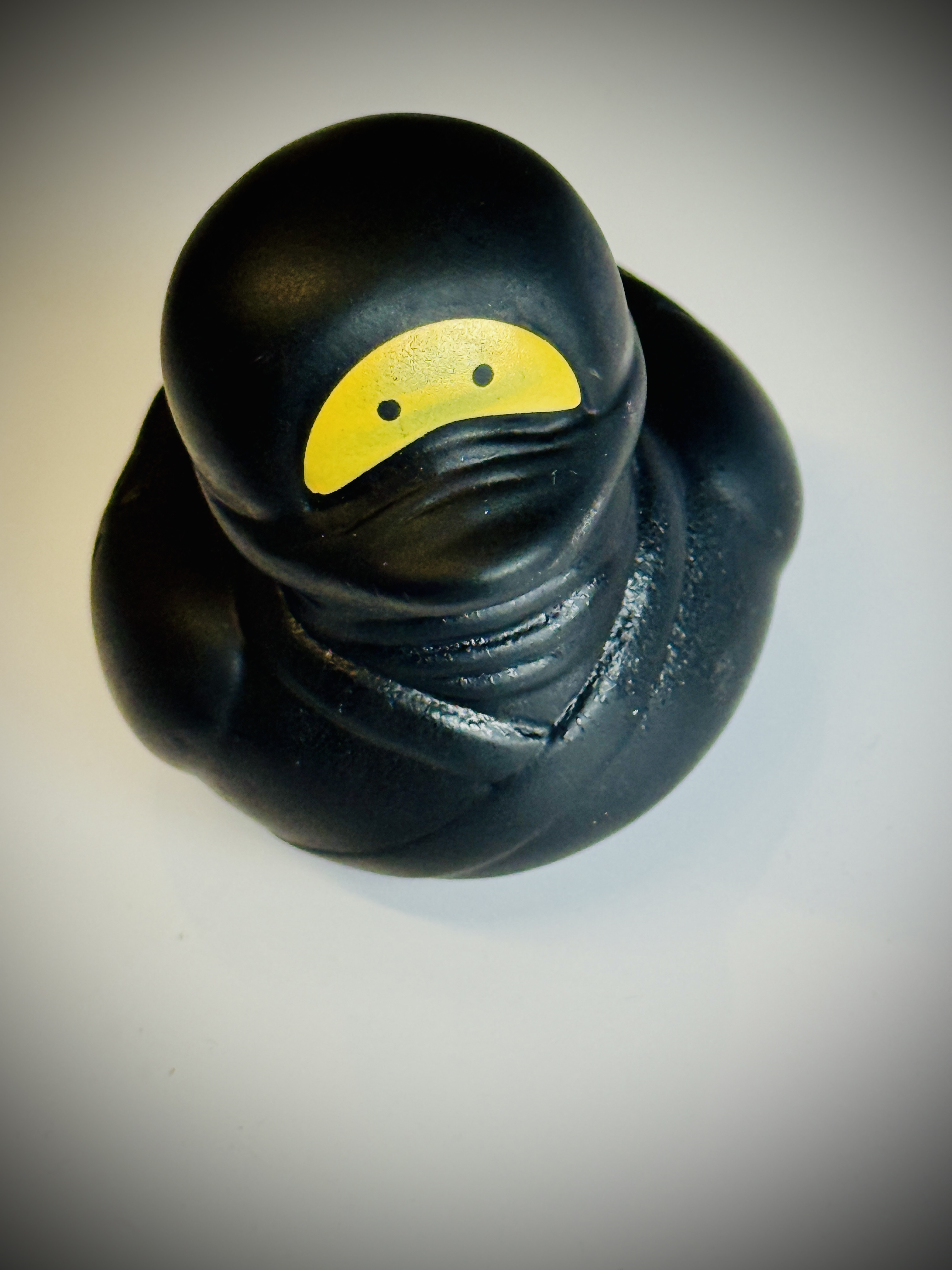Rubber duck dressed as a ninja with just the eyes showing, just like the old MoT logo image