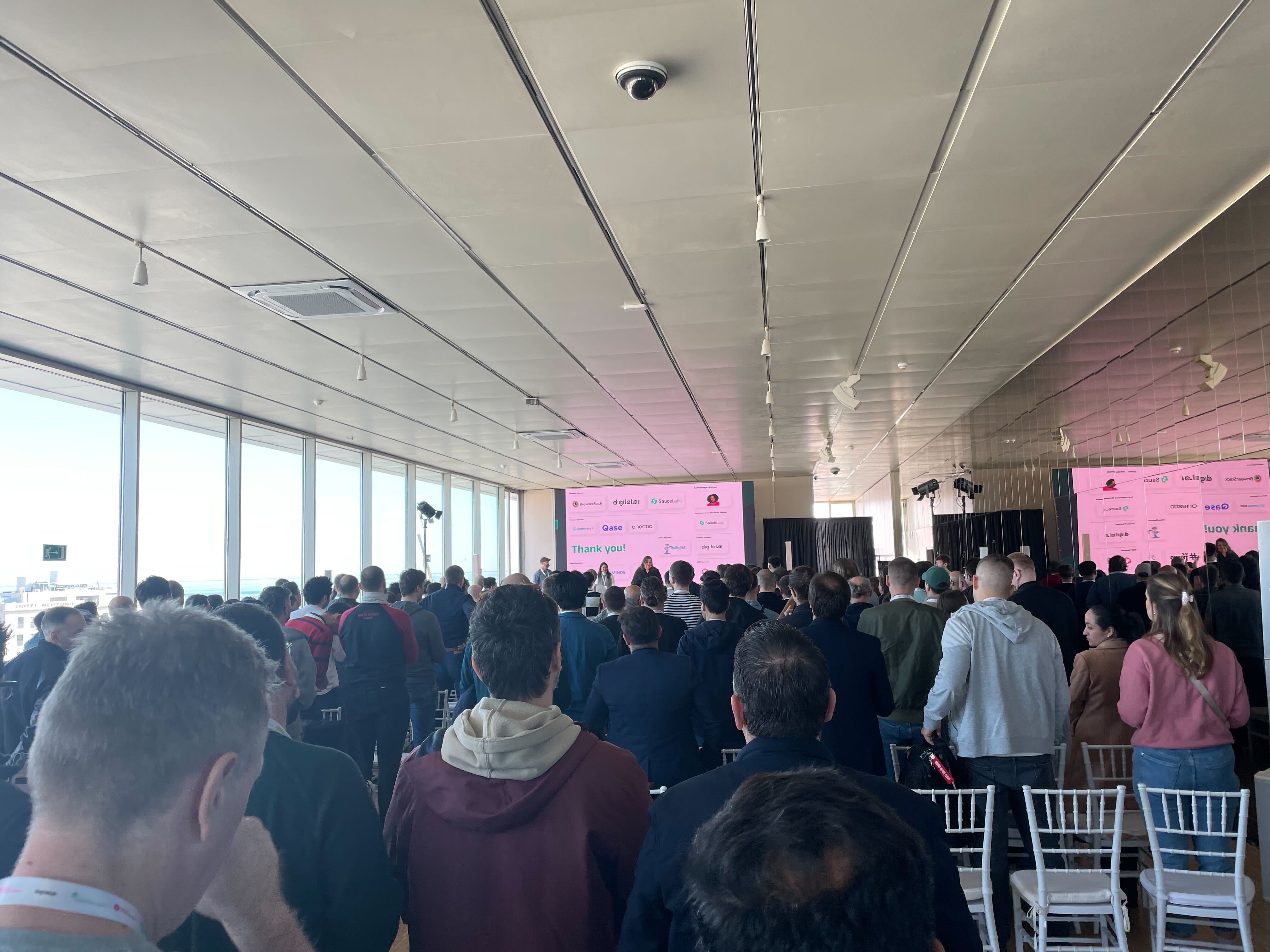 A photo of the audience of people from giving a standing ovation to Selenium Conference and the organisers.