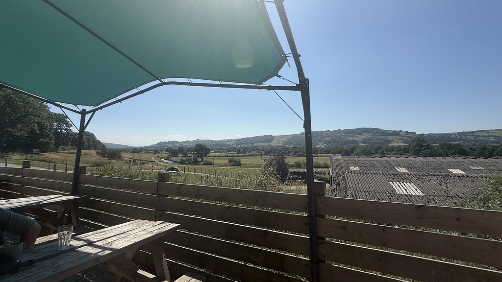 A view of the valley from a canal side cafe. You can see across to the rolling hills with houses interspersed with gr... image