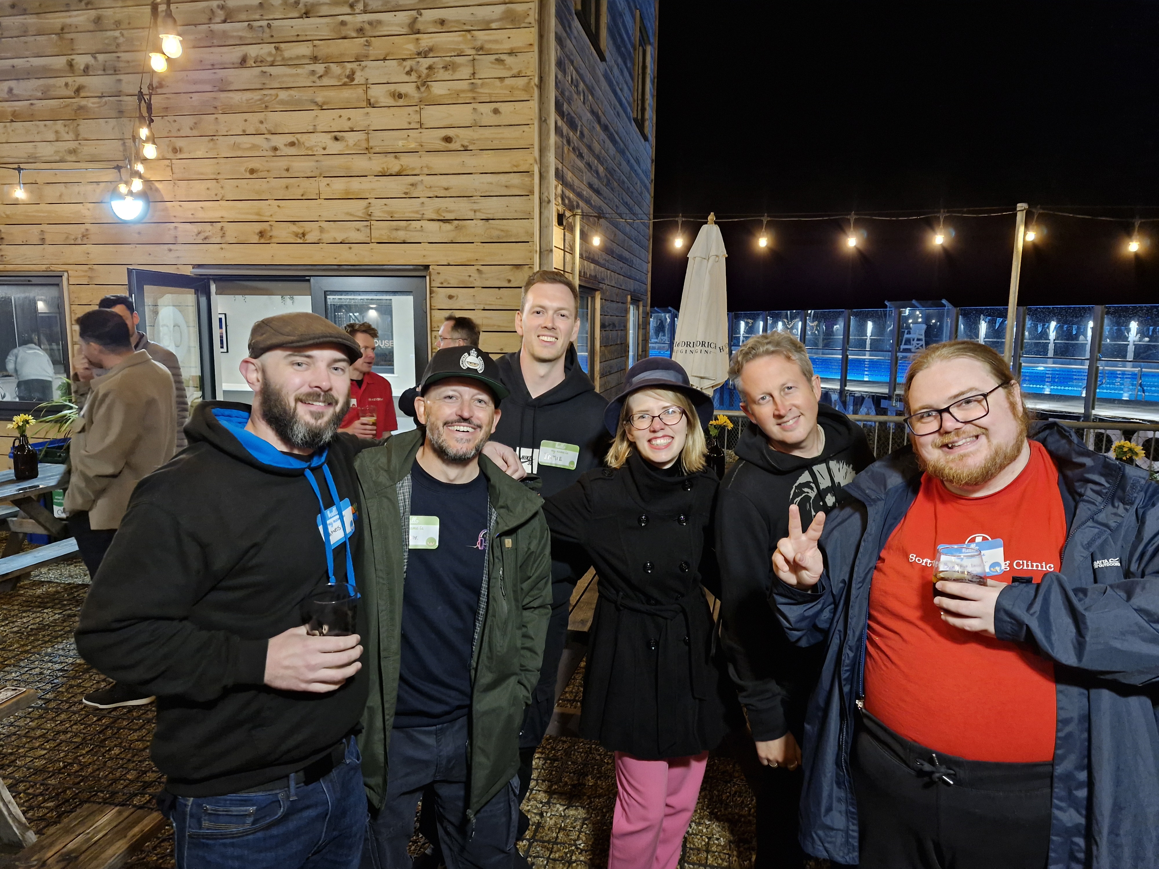 Group of testers enjoying a drink all posing for a photo.