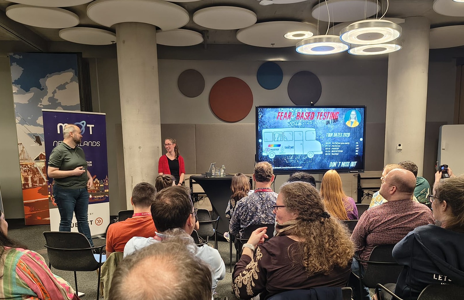 Suzanne presenting in front of the audience at the MoT Netherlands chapter night. image