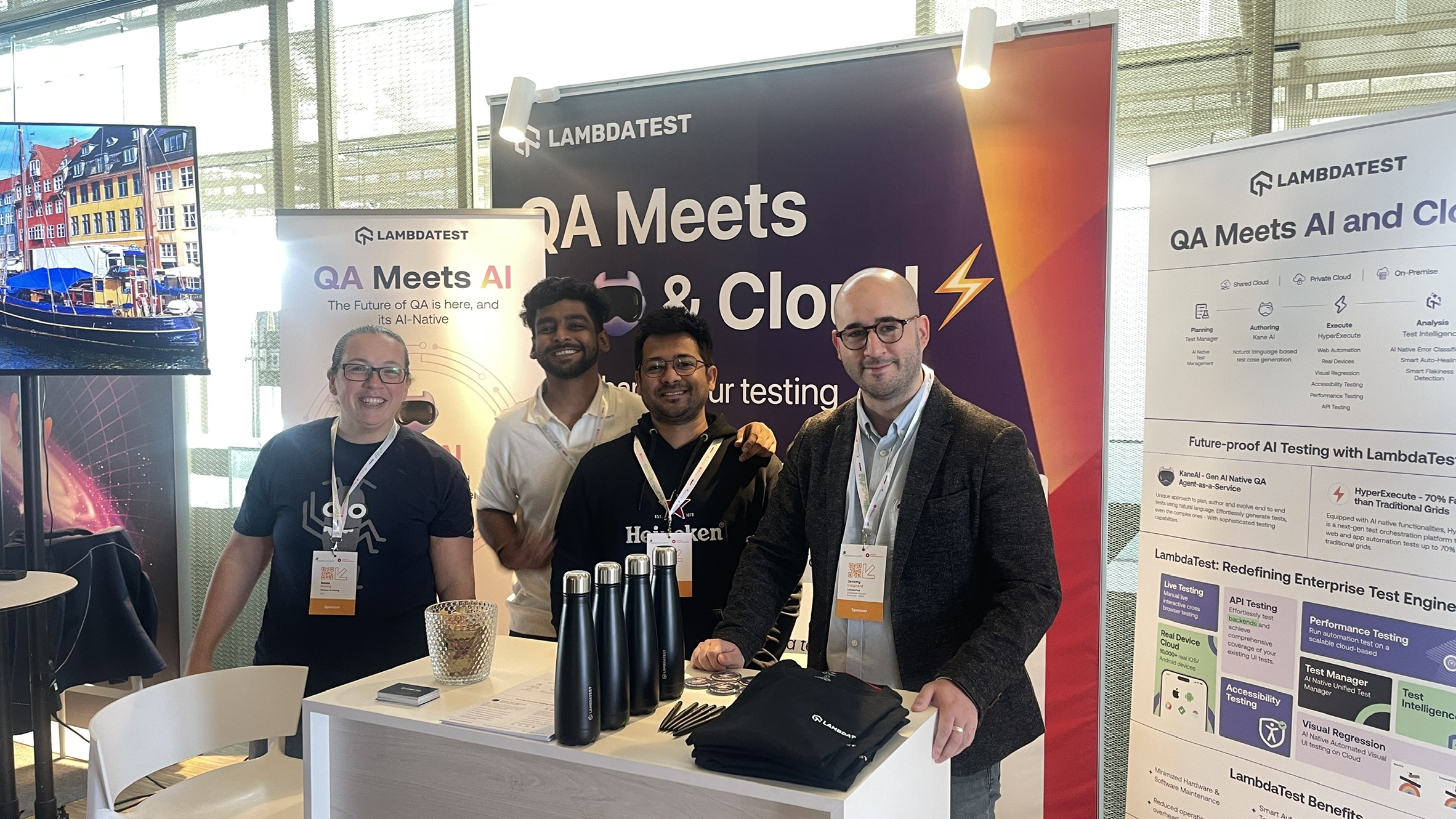 Rosie Sherry poses with the LambdaTest team at their booth during SeleniumConf. Smiles all around as they reconnect and chat all things QA and community.