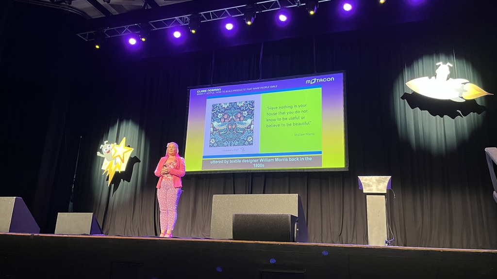 Claire Norman is the presenter of the talk on “Make it Joyful” is standing in front of a projected quote by William M... image