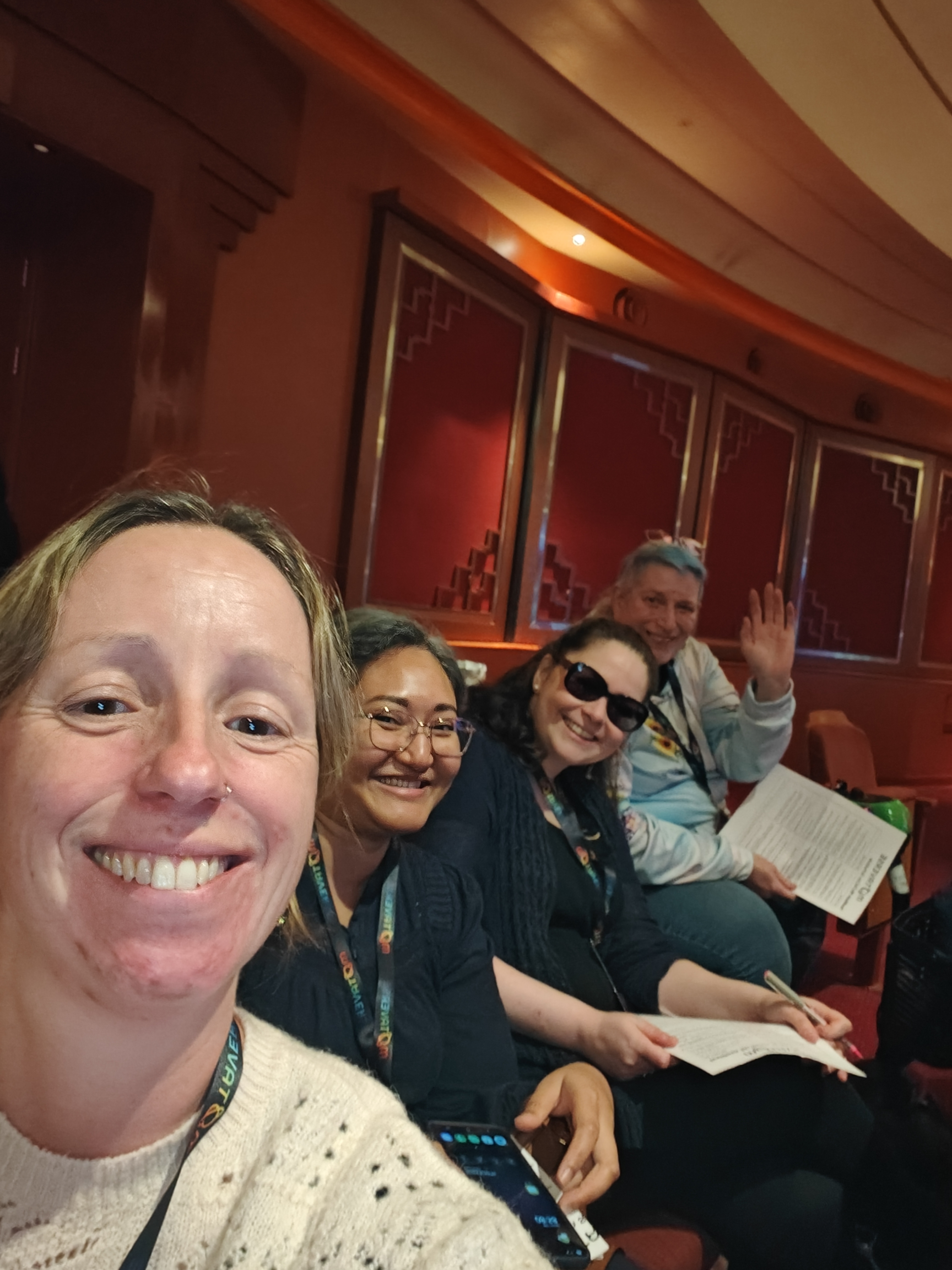 A selfie of four people at the motacon25