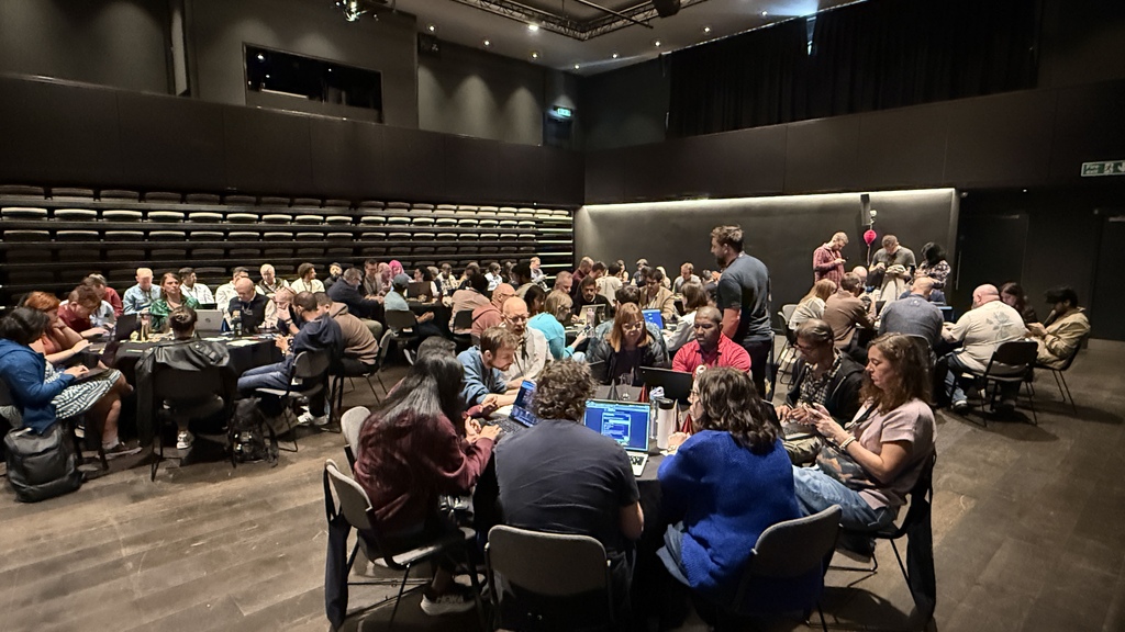 Full tables of people focused on their laptops  image