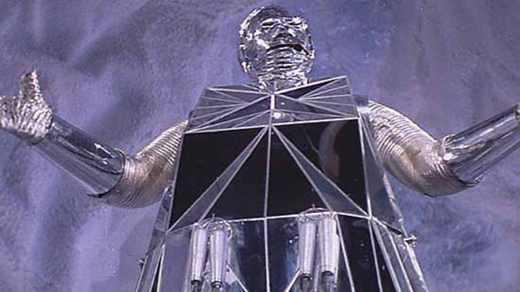 A 70s silver tin foil robot from logan's run (a wonderful 70's scifi film)
arms raised above his head. 
In the film he is saying "Overwhelming am I not" 
you do not have to agree with him but he is sparking joy.