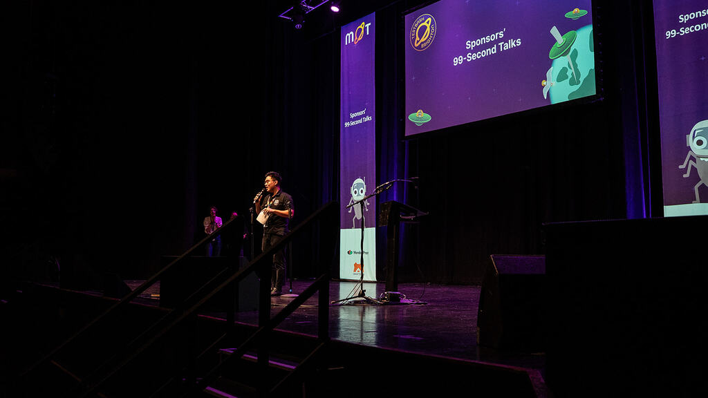 Vu Tran on the stage at MoTacon 25.