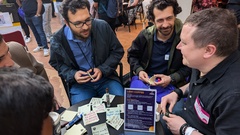 A group of people having a lean coffee session at TestBash 2024. image