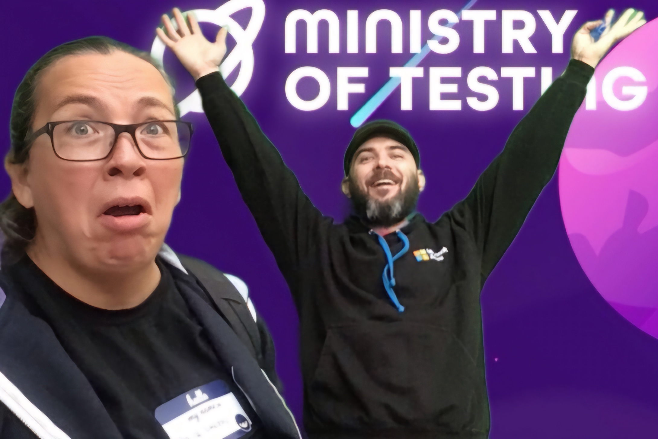 Two people are in front of a purple backdrop with "Ministry of Testing" written on it. One person looks surprised, wearing glasses and a name tag. The other is smiling with arms raised, wearing a black hoodie.