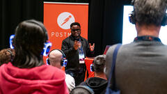 Gbadebo Bello representing Postman at MoTaCon25. image
