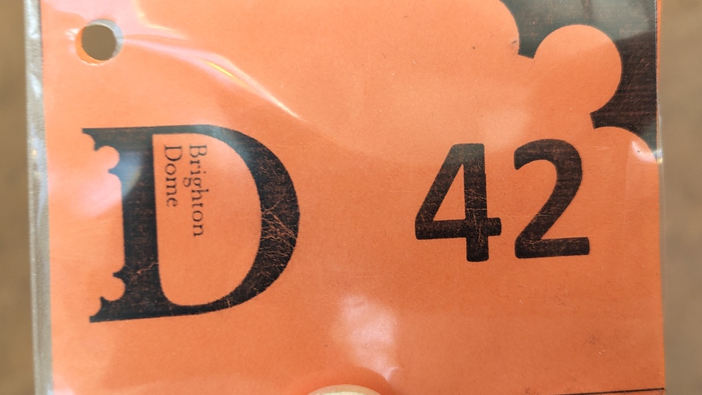 Receipt for bag drop with the number 42  image